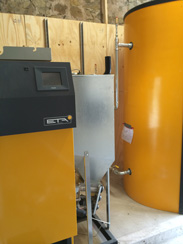 Biomass boiler and water tank during installation