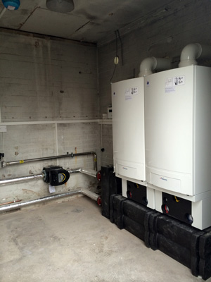 Two 65kW Worcester Bosch GB162 gas boilers installed at JCB, Wrexham